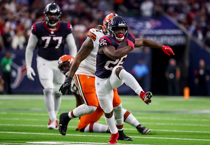 Texans running back Devin Singletary (26) runs with the ball during the second quarter in a 2024 AFC wild card game at NRG Stadium.